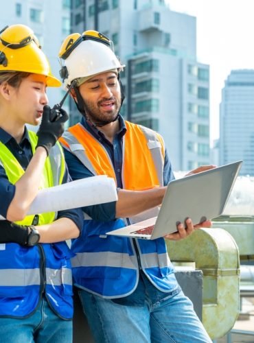 Professional,Asian,Man,And,Woman,Teamwork,Engineer,And,Foreman,Using